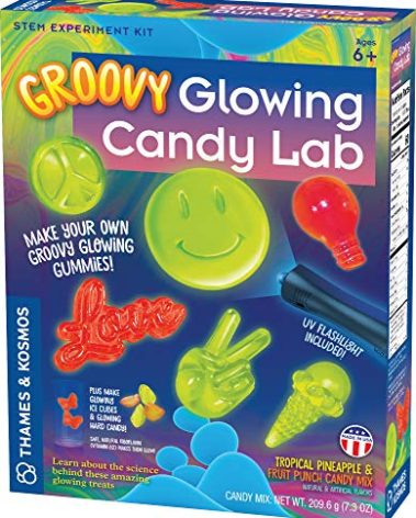 Thames & Kosmos Groovy Glowing Candy Lab STEM Kit | Make Glow-in-the-Dark Candies, Ice Cubes | Explore Luminescence & Chemistry of Gummies | Cool Shapes, Flavors, Safe to Eat | Includes LED Flashlight